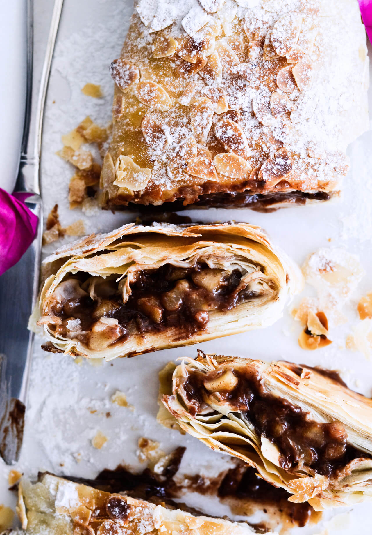 Easy chocolate pear strudel with cinnamon and almond flavor makes the perfect holiday dessert! Great warm or cold, made easily with phyllo pastry. Quick dessert!