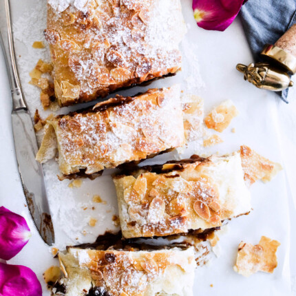Easy chocolate pear strudel with cinnamon and almond flavor makes the perfect holiday dessert! Great warm or cold, made easily with phyllo pastry. Quick dessert!