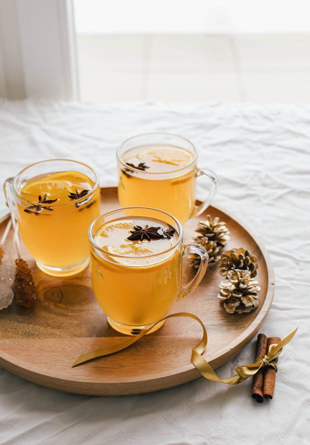 Easy and delicious mulled white wine with oranges, cinnamon, star anise and more.