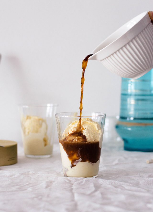 pouring coffee over vanilla ice cream