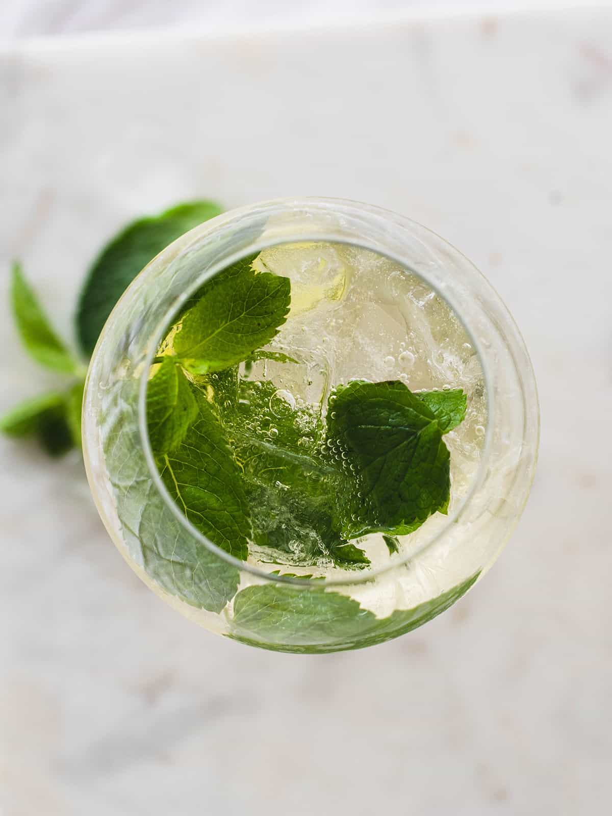 close view of mint leaves in wine