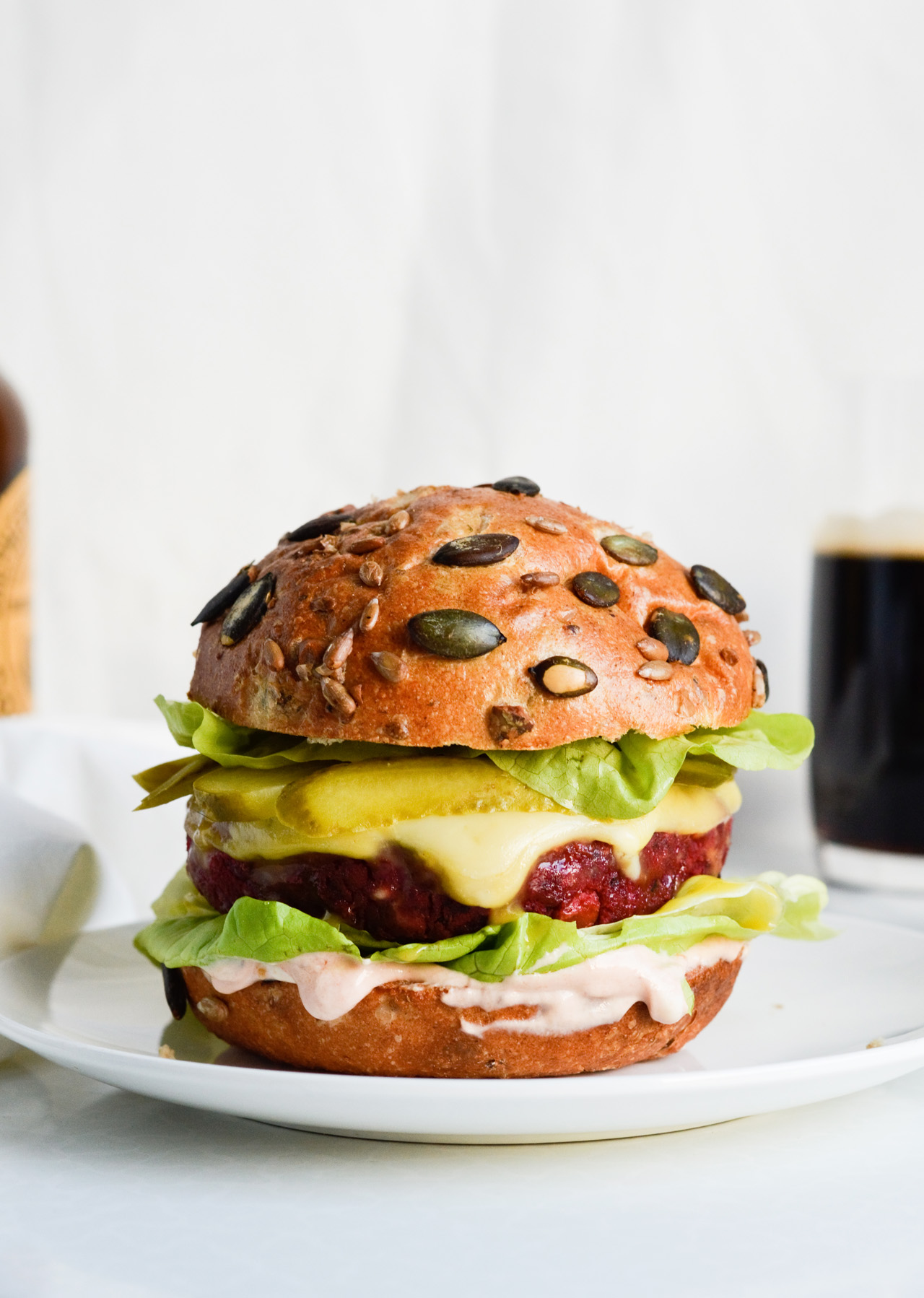 Royal vegetarian bean beet burger is the best vegetarian burger ever. Made with beets, beans, topped with honey mustard, cheese, lettuce, pickles and more! Totally dreamy, can be made ahead.