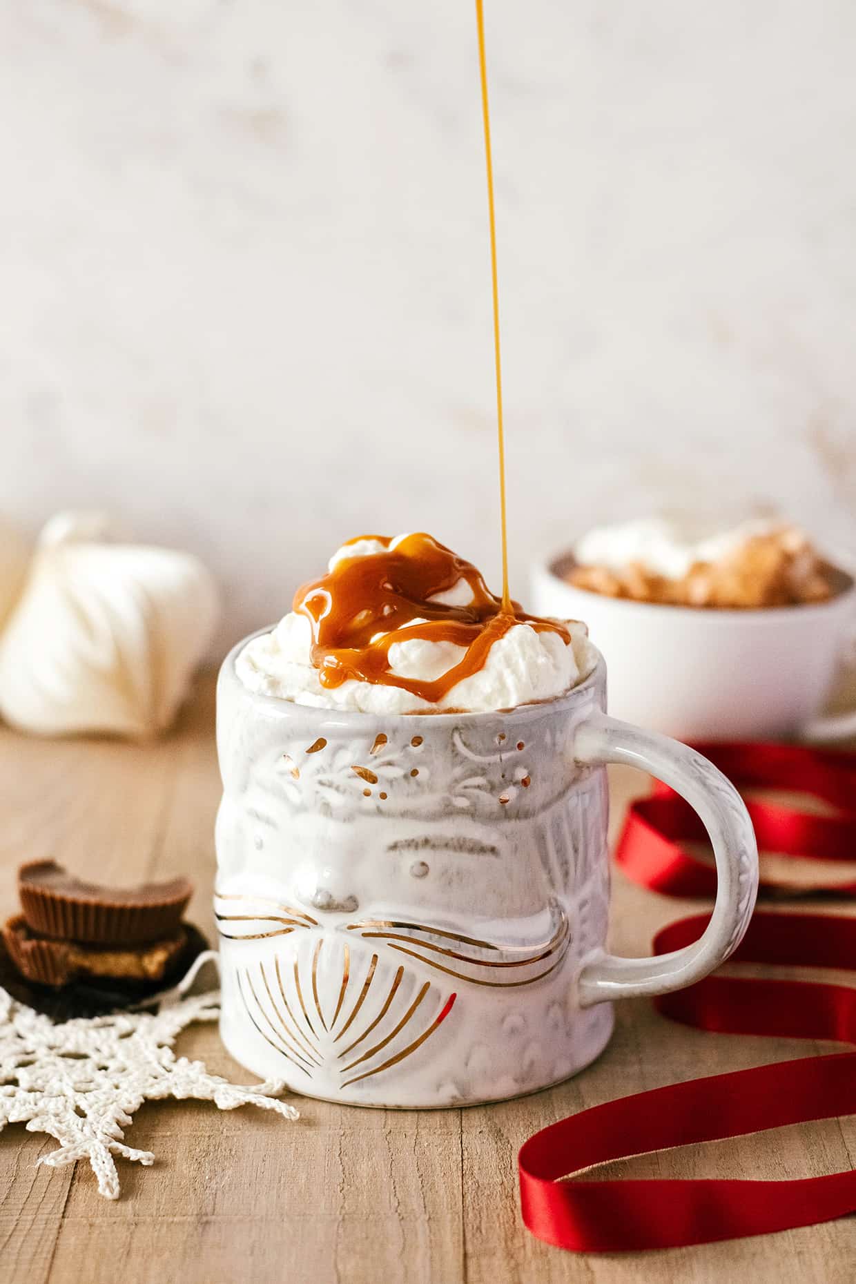 peanut butter cup hot chocolate with whipped cream and caramel 
