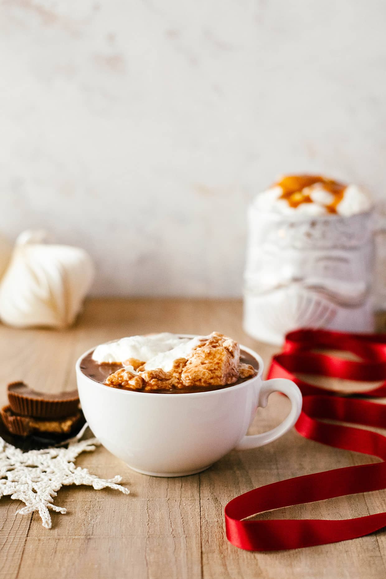 peanut butter cup hot chocolate with whipped cream and caramel