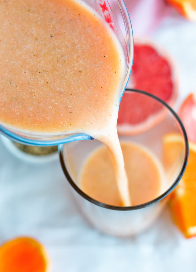 pouring smoothie in glass