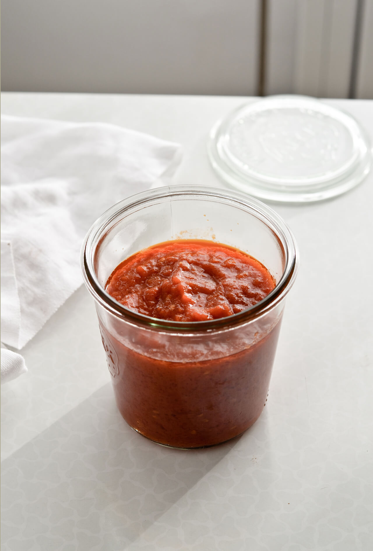 Year-round homemade tomato sauce made with canned tomatoes. Perfect for pizza and pasta.