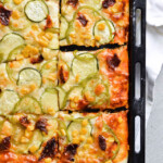 Best vegetable sheet pizza! Made with homemade pizza dough and quick pizza sauce, topped with zucchini, peppers, corn and much more! So easy to make, great for dinner and a crowd. | sugarsalted.com