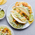 Guacamole cabbage bean tacos are the best vegetarian tacos! With easy homemade guacamole, zesty cabbage, zucchini, paprika beans and lots of cheddar! | sugarsalted.com