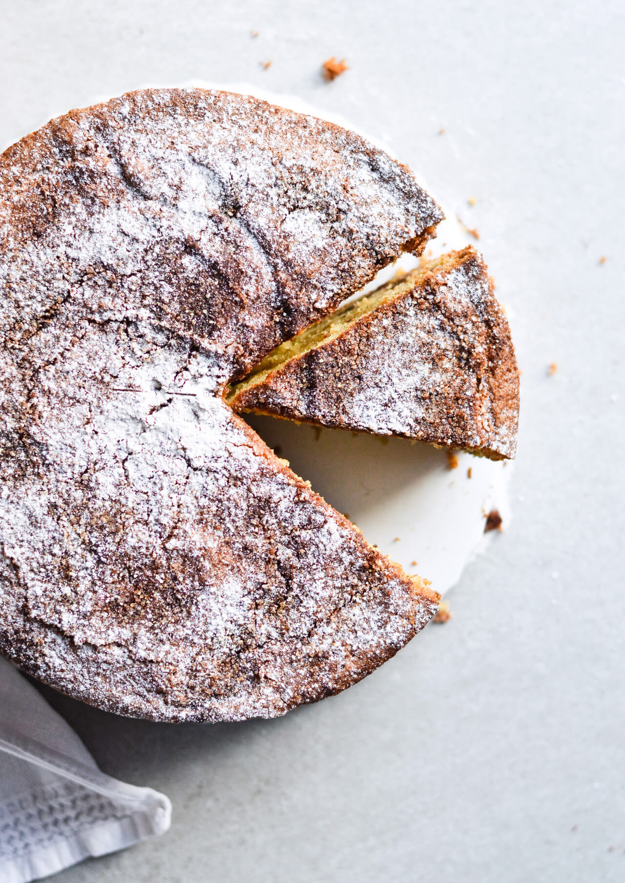 sour cream cinnamon coffee cake sprinkled with powdered sugar