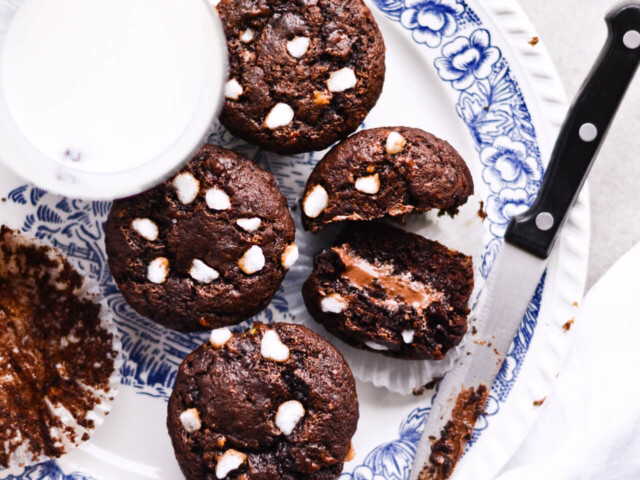 Nutella-stuffed chocolate banana bread muffins! Taste rum-like and chocolaty, with a gooey Nutella surprise and pearl sugar on top! | sugarsalted.com