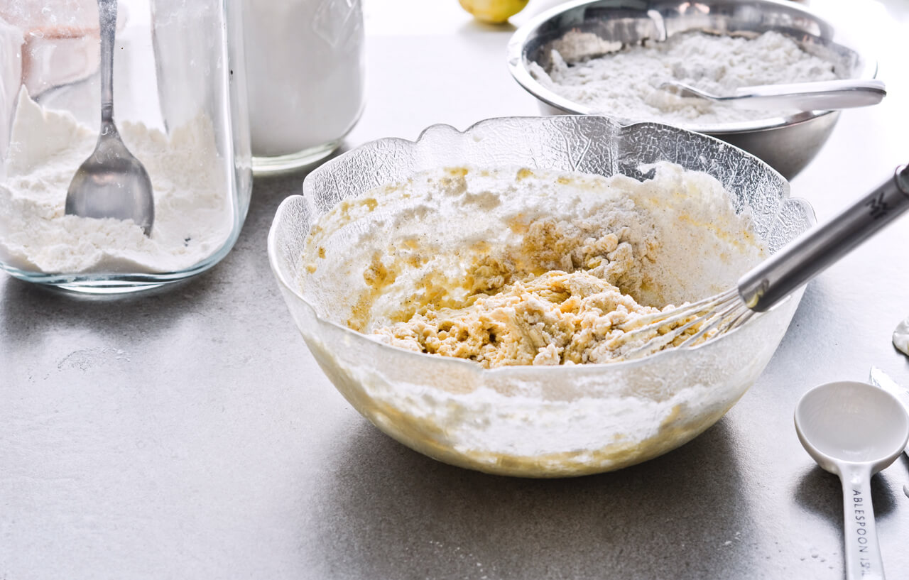 Recipe for Slovenian apple pie, which is almost a torte. Made with a sour cream, crumbly and cookie-like crust, topped with grated apples which make a very juicy filling. Easily sliced into pieces and perfect for serving to a group or potluck parties. Very easy to make. | sugarsalted.com