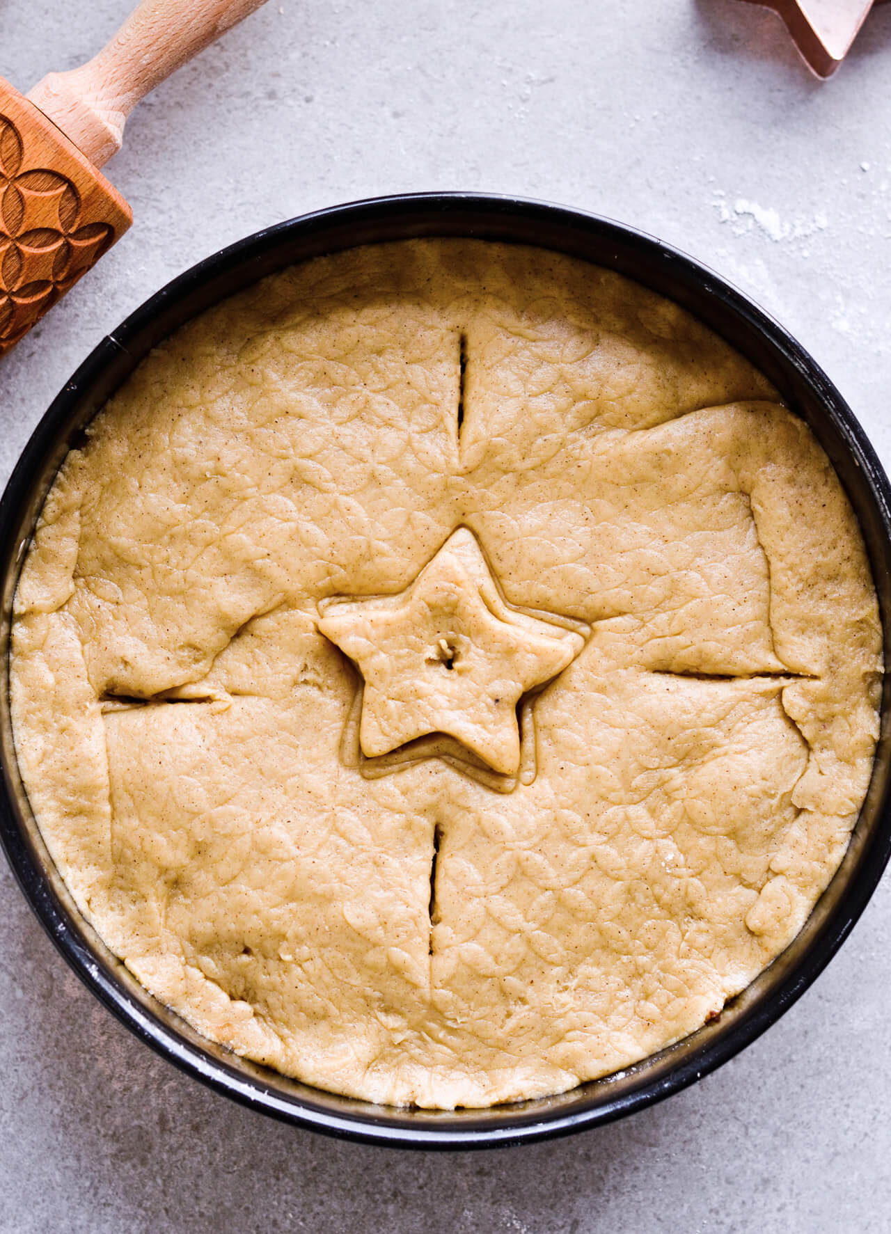 Recipe for Slovenian apple pie, which is almost a torte. Made with a sour cream, crumbly and cookie-like crust, topped with grated apples which make a very juicy filling. Easily sliced into pieces and perfect for serving to a group or potluck parties. Very easy to make. | sugarsalted.com