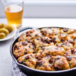Recipe for sun-dried tomato herb skillet rolls. Dough infused with oregano and rolls drenched with parsley butter and sun-dried tomatoes. Soft, individual rolls straight from the skillet, great for the holiday dinner table. | sugarsalted.com