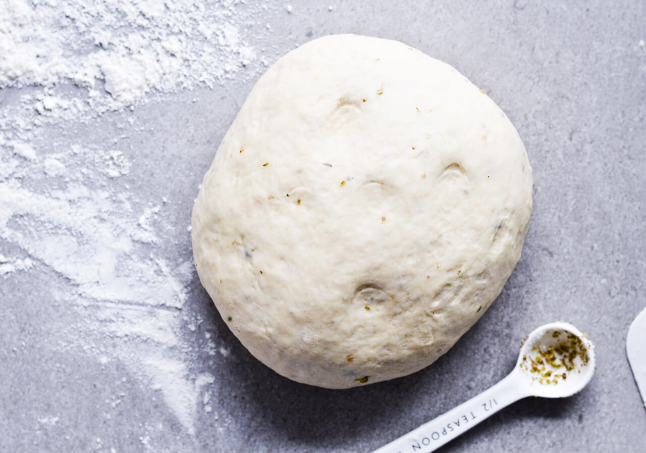 Recipe for sun-dried tomato herb skillet rolls. Dough infused with oregano and rolls drenched with parsley butter and sun-dried tomatoes. Soft, individual rolls straight from the skillet, great for the holiday dinner table. | sugarsalted.com