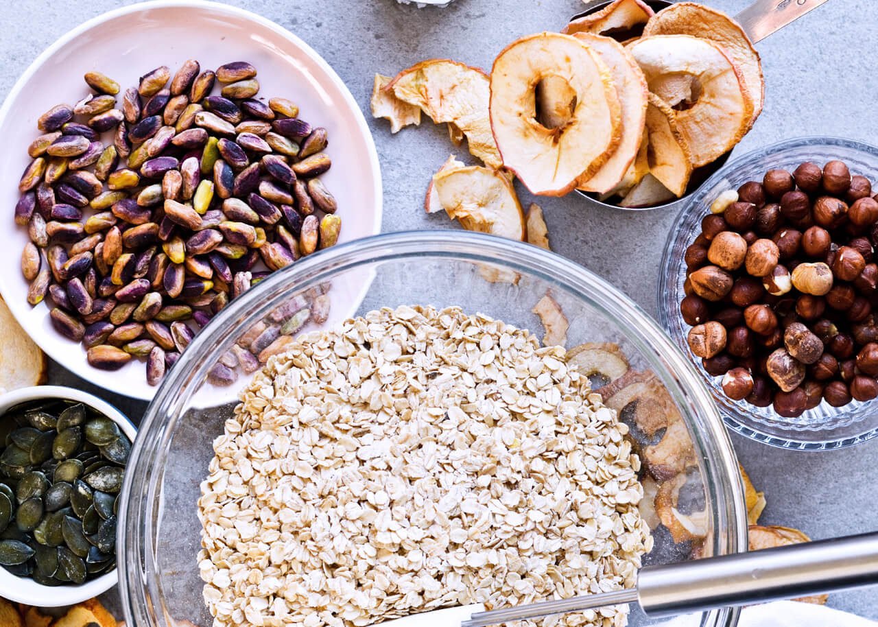 Recipe for Cinnamon apple pistachio soft granola, packed with hazelnuts, sunflower seeds, maple syrup and honey, it is a real treat that makes breakfast wonderful. A jar of granola can also be a great homemade gift. | @mitzyathome sugarsalted.com