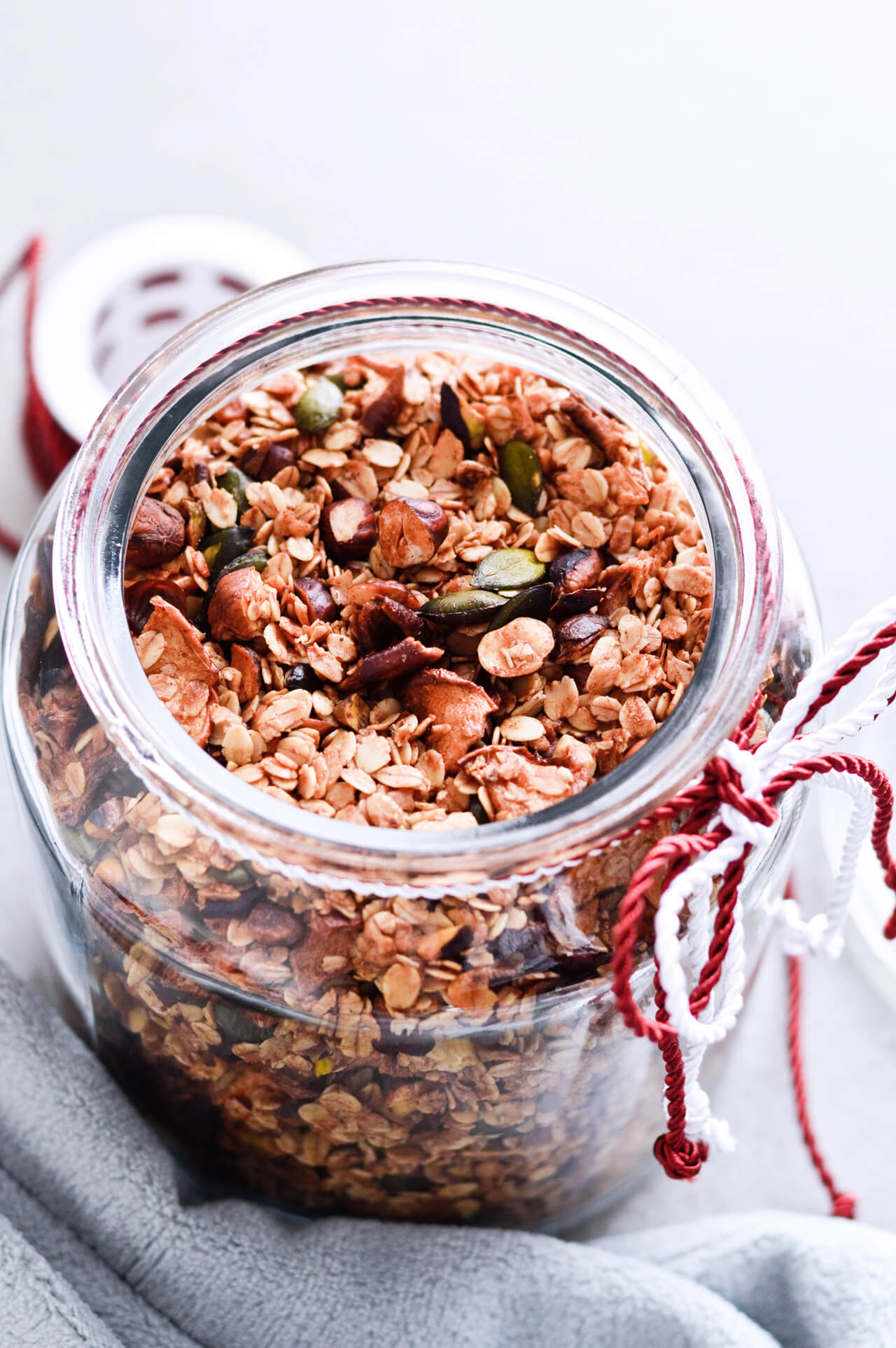 Recipe for Cinnamon apple pistachio soft granola, packed with hazelnuts, sunflower seeds, maple syrup and honey, it is a real treat that makes breakfast wonderful. A jar of granola can also be a great homemade gift. | @mitzyathome sugarsalted.com