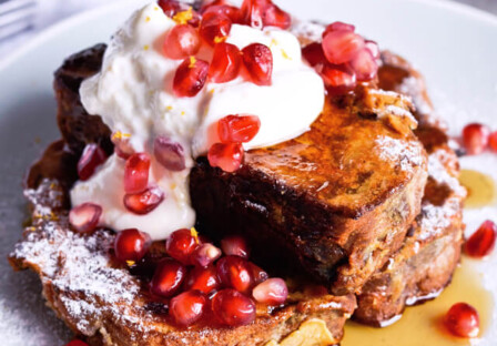 Recipe for Orange yogurt Stollen french toast. Christmas Stollen prepared as classic french toast, topped with creamy orange Greek yogurt, pomegranate seeds, maple syrup. Perfect breakfast or brunch recipe. | @mitzyathome sugarsalted.com