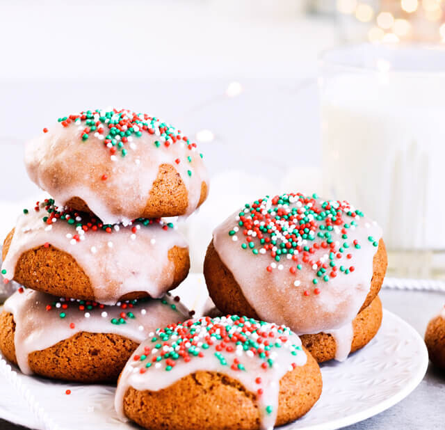 Recipe for Sugar glazed lebkuchen (German Christmas cookies), the perfect spicy and sweet cookies. Great for Christmas or any cold month, they're filled with honey and wonderful, aromatic spices. The festive sprinkles add that extra holiday touch. | @mitzyathome sugarsalted.com