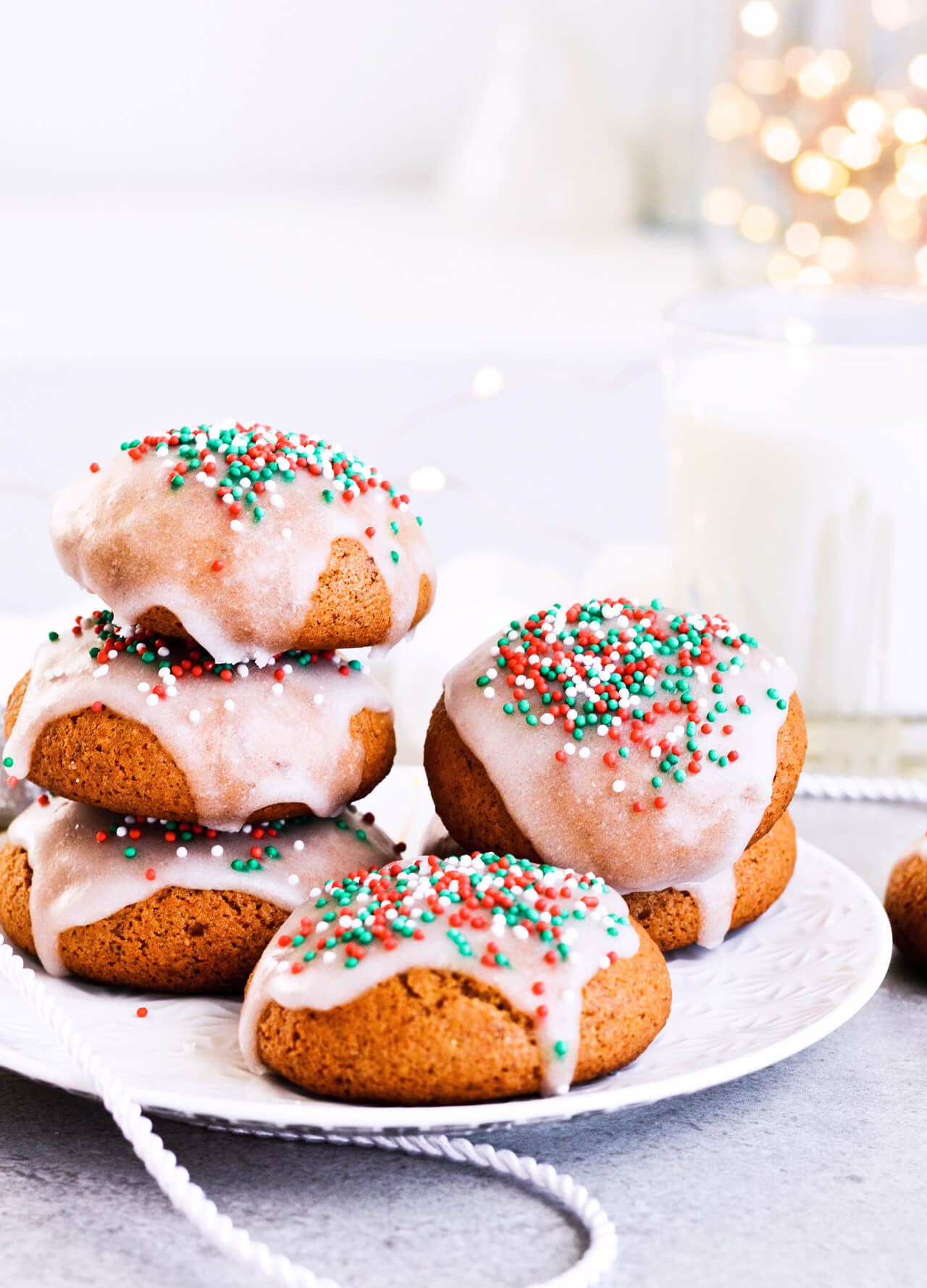 Recipe for Sugar glazed lebkuchen (German Christmas cookies), the perfect spicy and sweet cookies. Great for Christmas or any cold month, they're filled with honey and wonderful, aromatic spices. The festive sprinkles add that extra holiday touch. | @mitzyathome sugarsalted.com