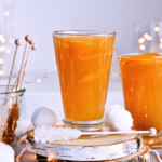 Recipe for Winter tea rum punch, the perfect winter cozy drink! Made with orange juice, honey, ginger beer and cinnamon baked apple teas! Served with orange twists and sugar swizzle sticks. A great cocktail made in 15 minutes! | @mitzyathome sugarsalted.com