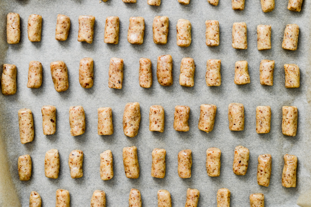 walnut cookies on a baking sheet