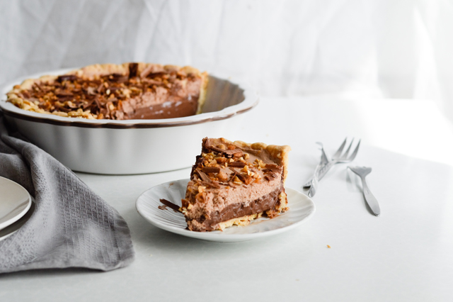 Chocolate pudding pie with nutella cream and peanuts - chocolate pudding pie topped with Nutella whipped cream and toasted peanuts for the ultimae pleasure. Chocolate lover's favorite pie.