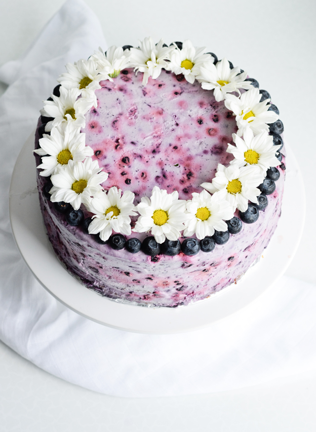 Very blueberry layer cake - a pretty purple sour cream cake with whipped cream and fresh blueberries! Great for birthdays, picnics, parties, weddings.
