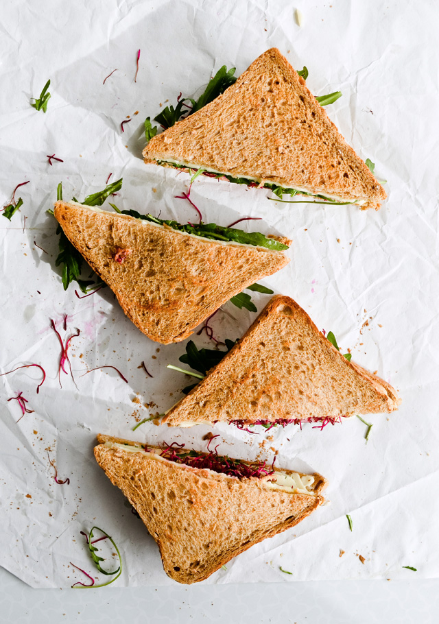 This cheese mustard veggie sandwich is a perfect quick lunch. Made with beet sprouts, arugula, wonderful cheese and much more. 