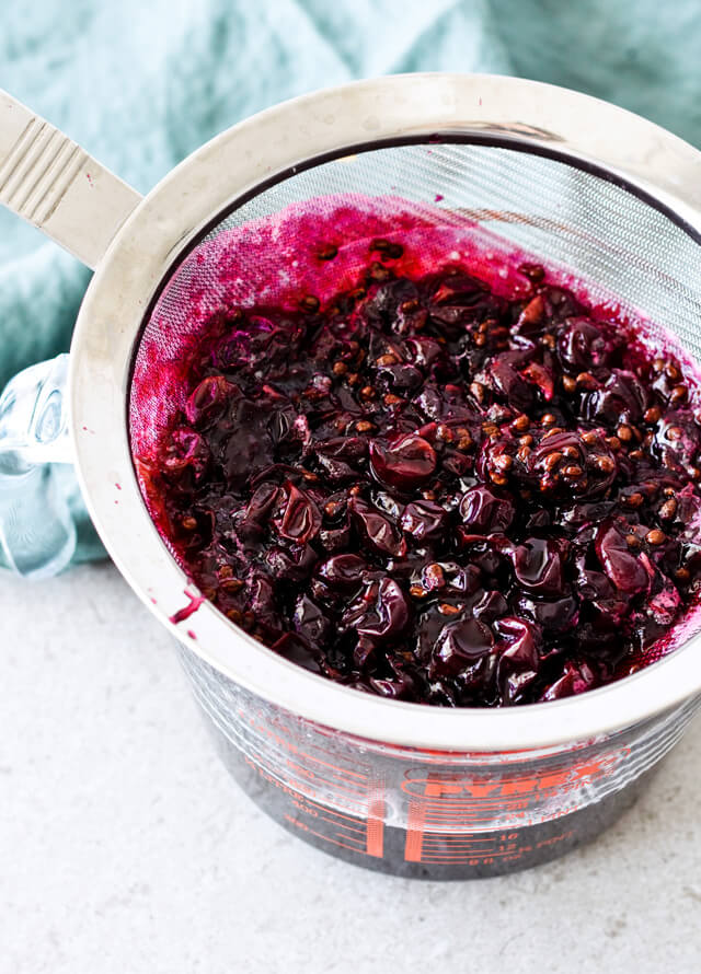 Concord grape syrup ginger beer floats will make you feel like a child again! Made with easy homemade syrup and lots of vanilla ice cream, these make the perfect early Fall - Autumn treat.