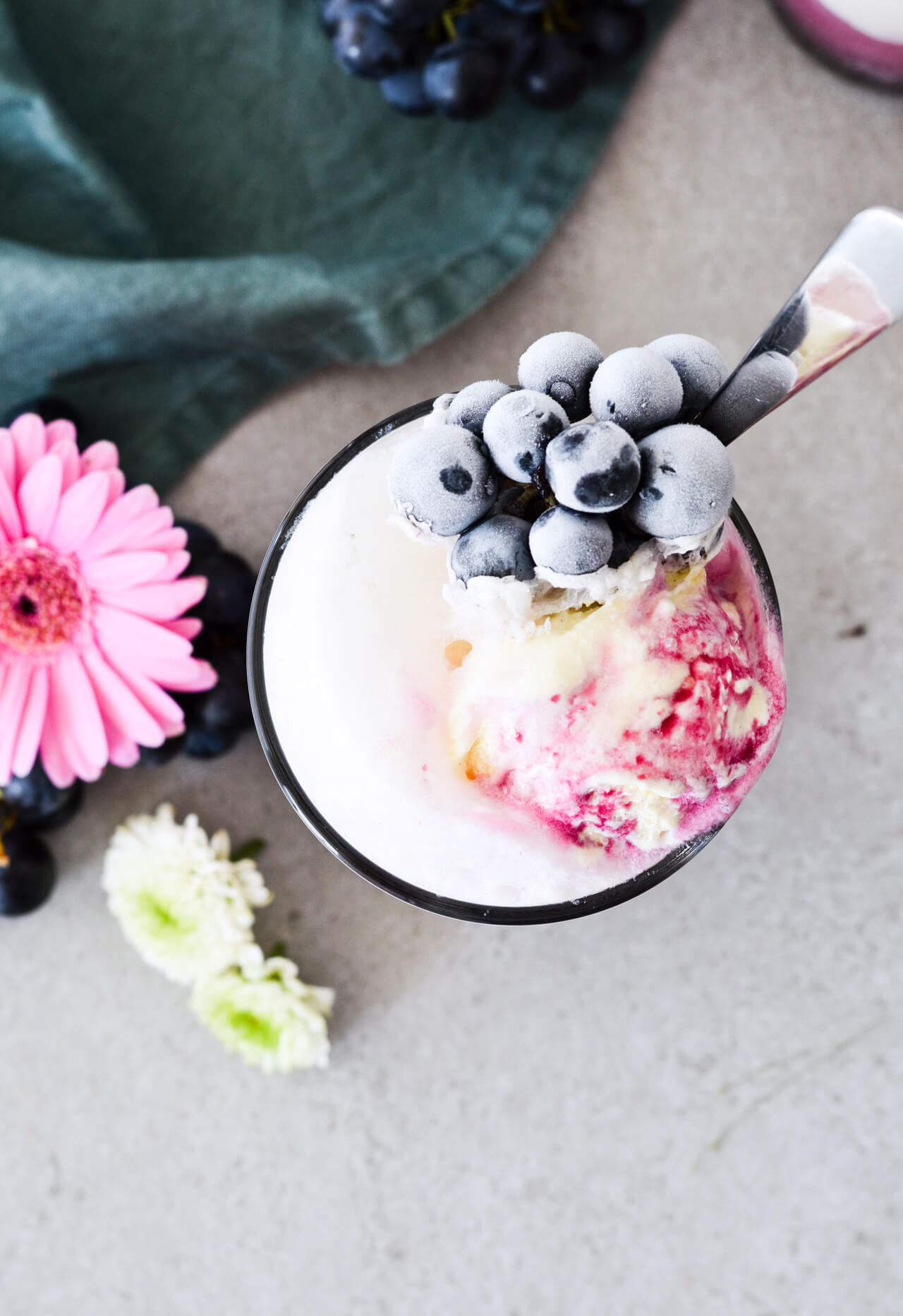 Concord grape syrup ginger beer floats will make you feel like a child again! Made with easy homemade syrup and lots of vanilla ice cream, these make the perfect early Fall - Autumn treat.