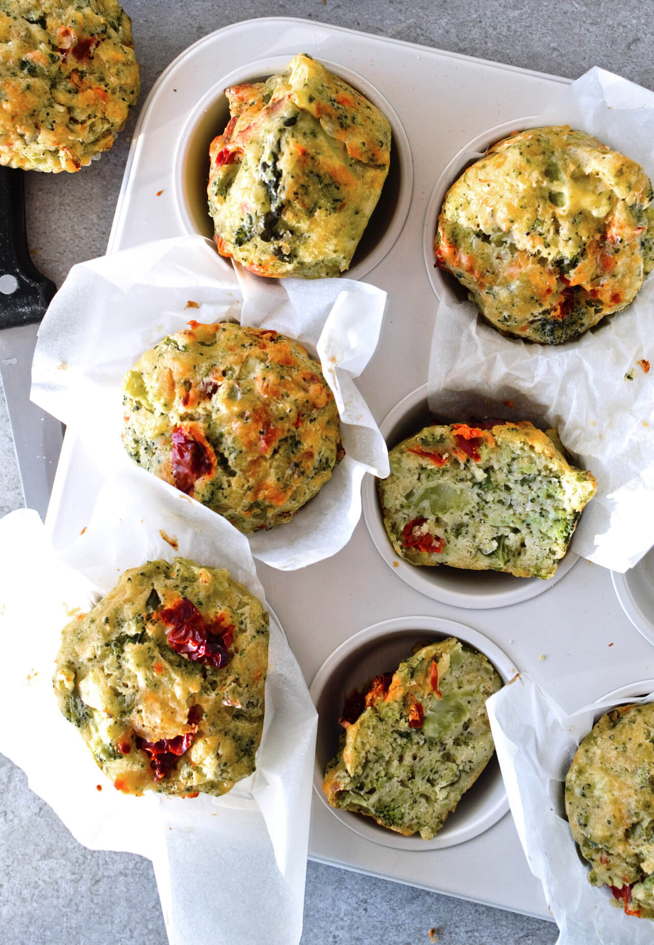 Olive oil broccoli muffins with cabbage and sun-dried tomatoes make the perfect breakfast on the go, or a side to your lunch salad or dinner meal. Great for kids too!