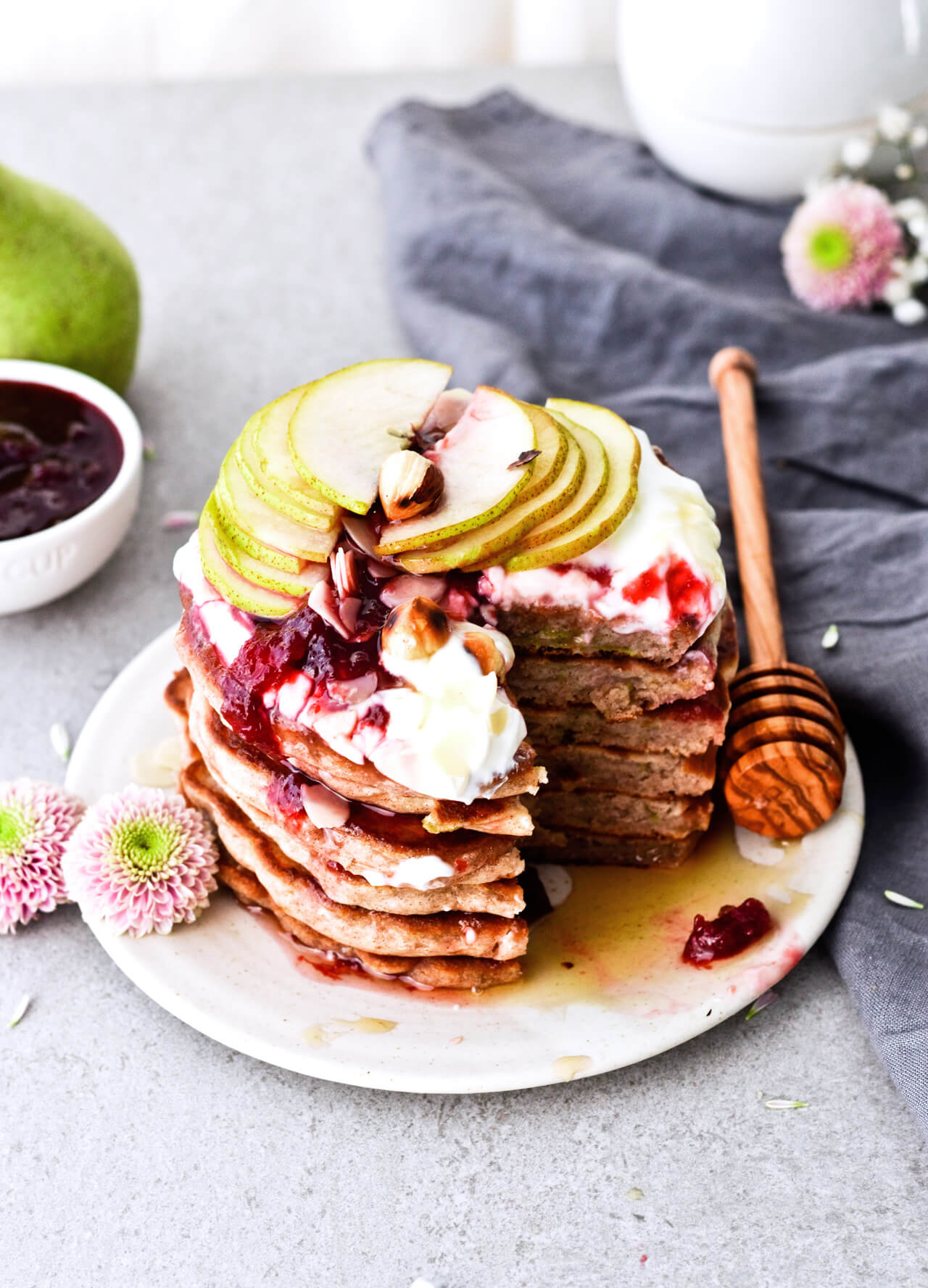 Recipe for shredded pear pancakes with yogurt and honey! Perfect Fall brunch recipe that makes fluffy, fruity pancakes everyone can enjoy.