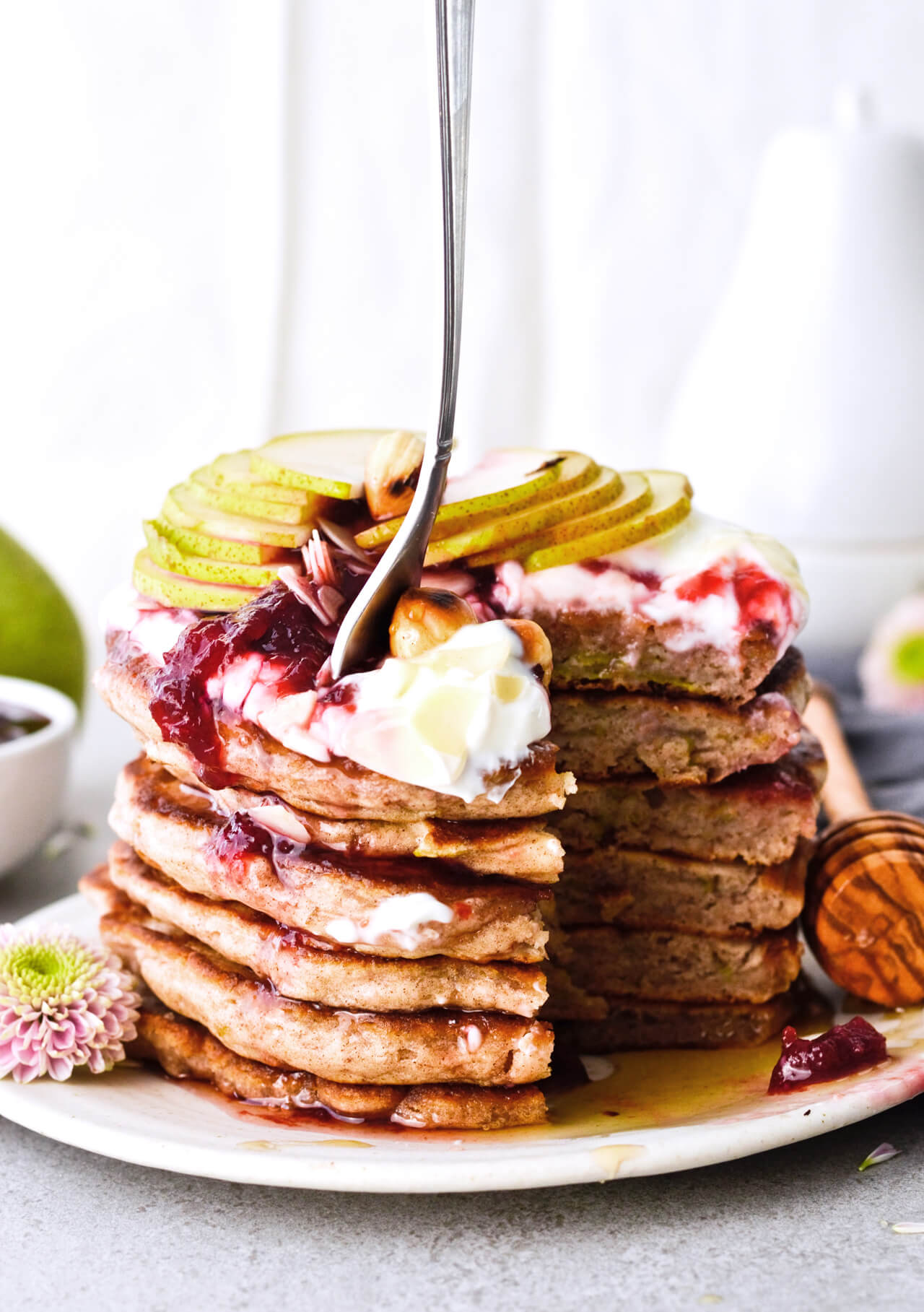 Recipe for shredded pear pancakes with yogurt and honey! Perfect Fall brunch recipe that makes fluffy, fruity pancakes everyone can enjoy.