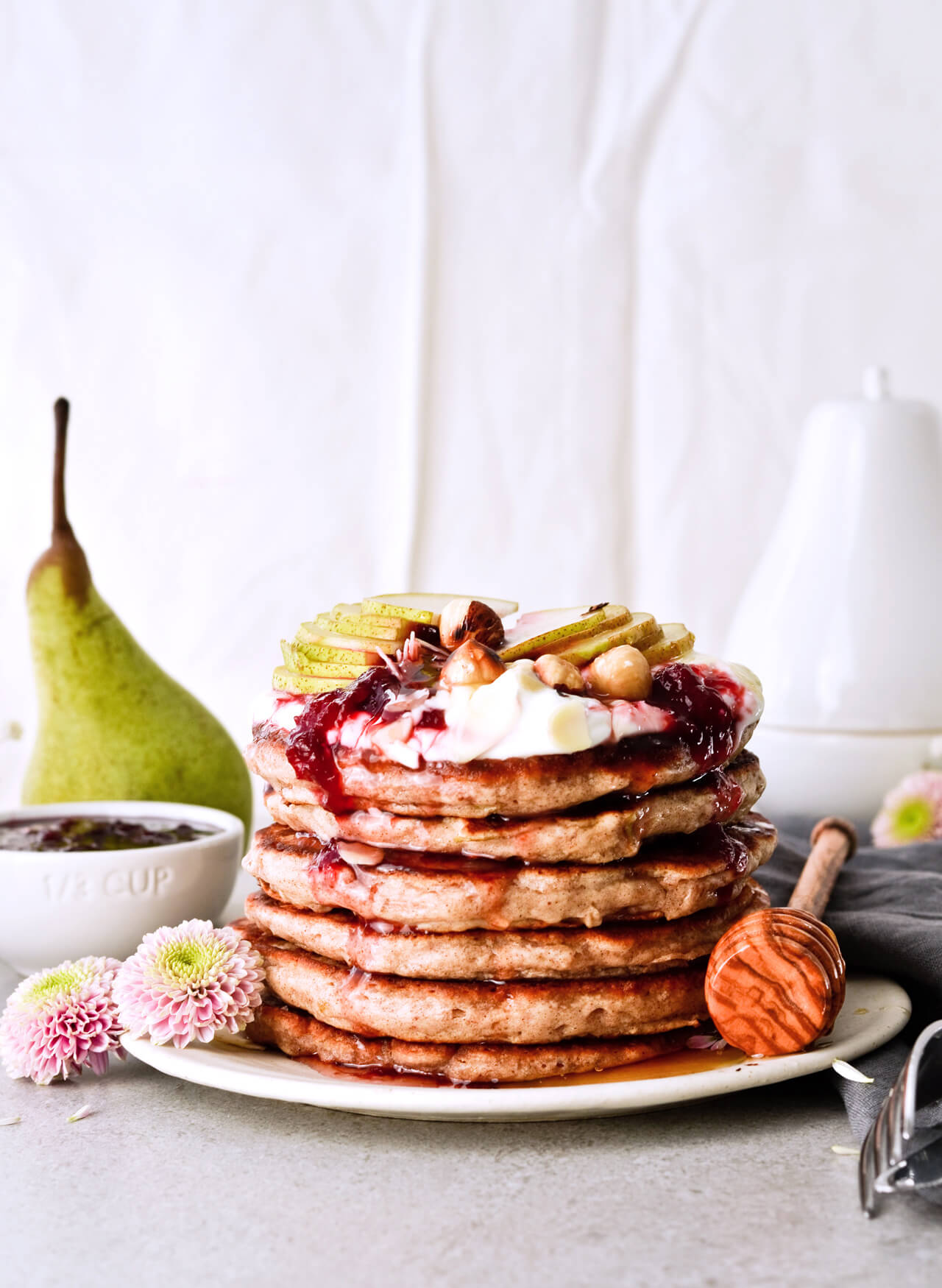 Recipe for shredded pear pancakes with yogurt and honey! Perfect Fall brunch recipe that makes fluffy, fruity pancakes everyone can enjoy.