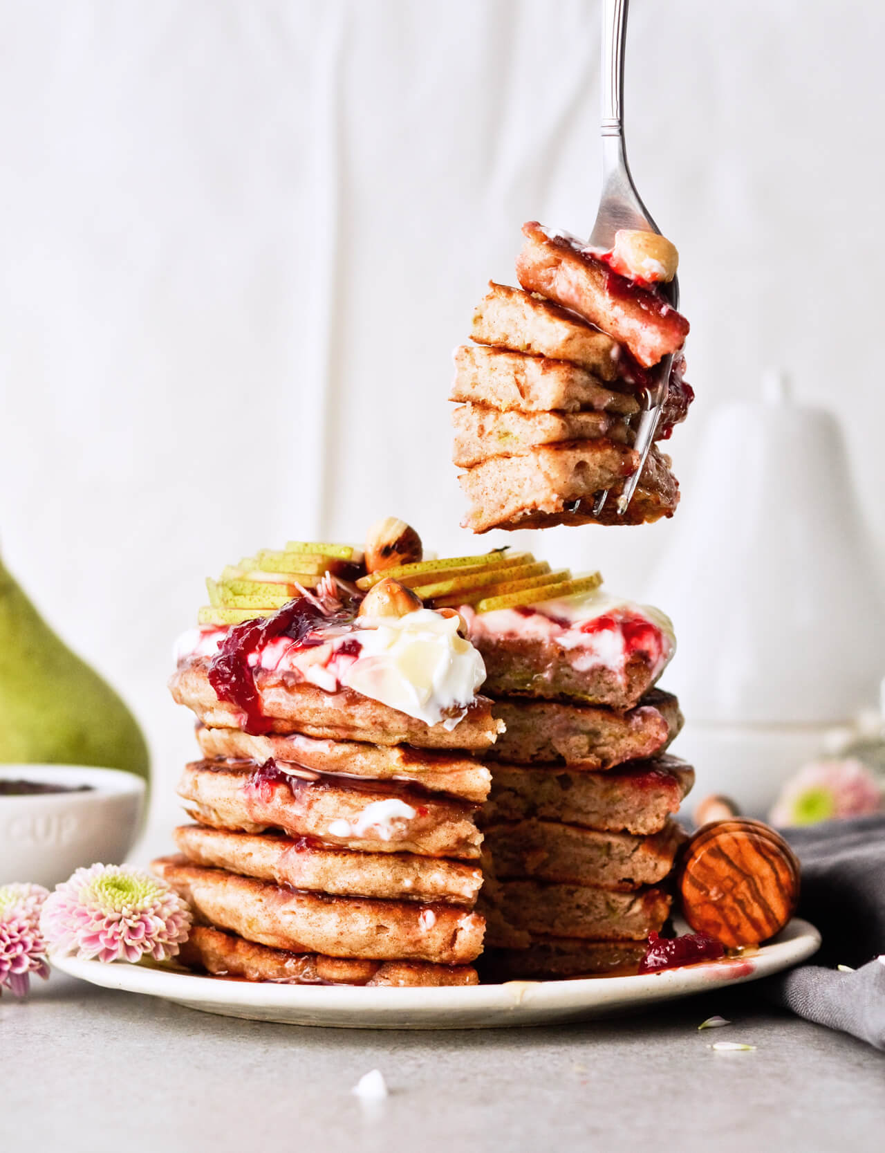 Recipe for shredded pear pancakes with yogurt and honey! Perfect Fall brunch recipe that makes fluffy, fruity pancakes everyone can enjoy. 