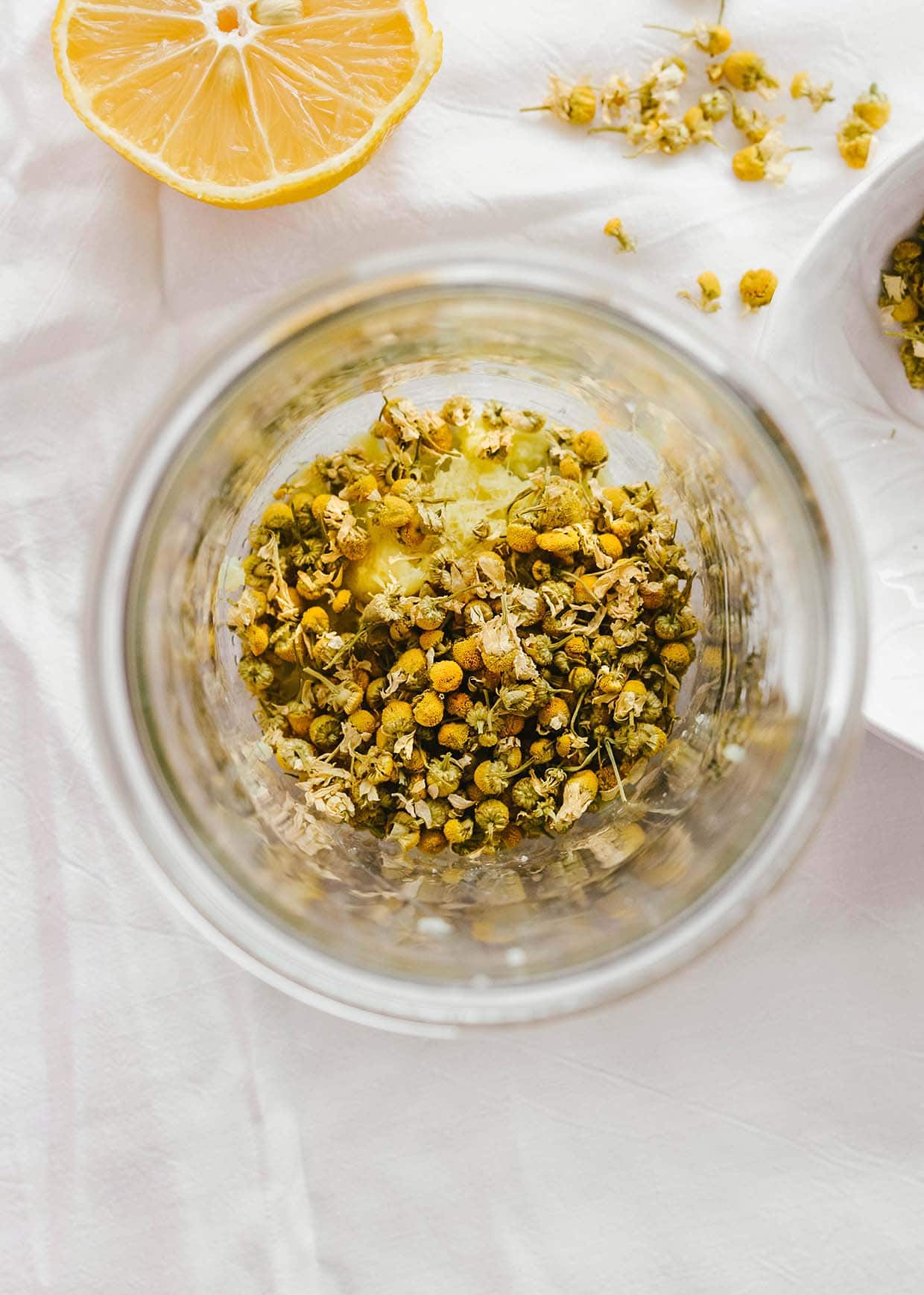 dried chamomile flowers in glass jar