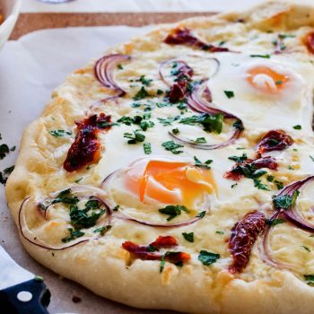 Easy sun dried tomato onion breakfast pizza with eggs, easy brunch recipe that is quickly made.