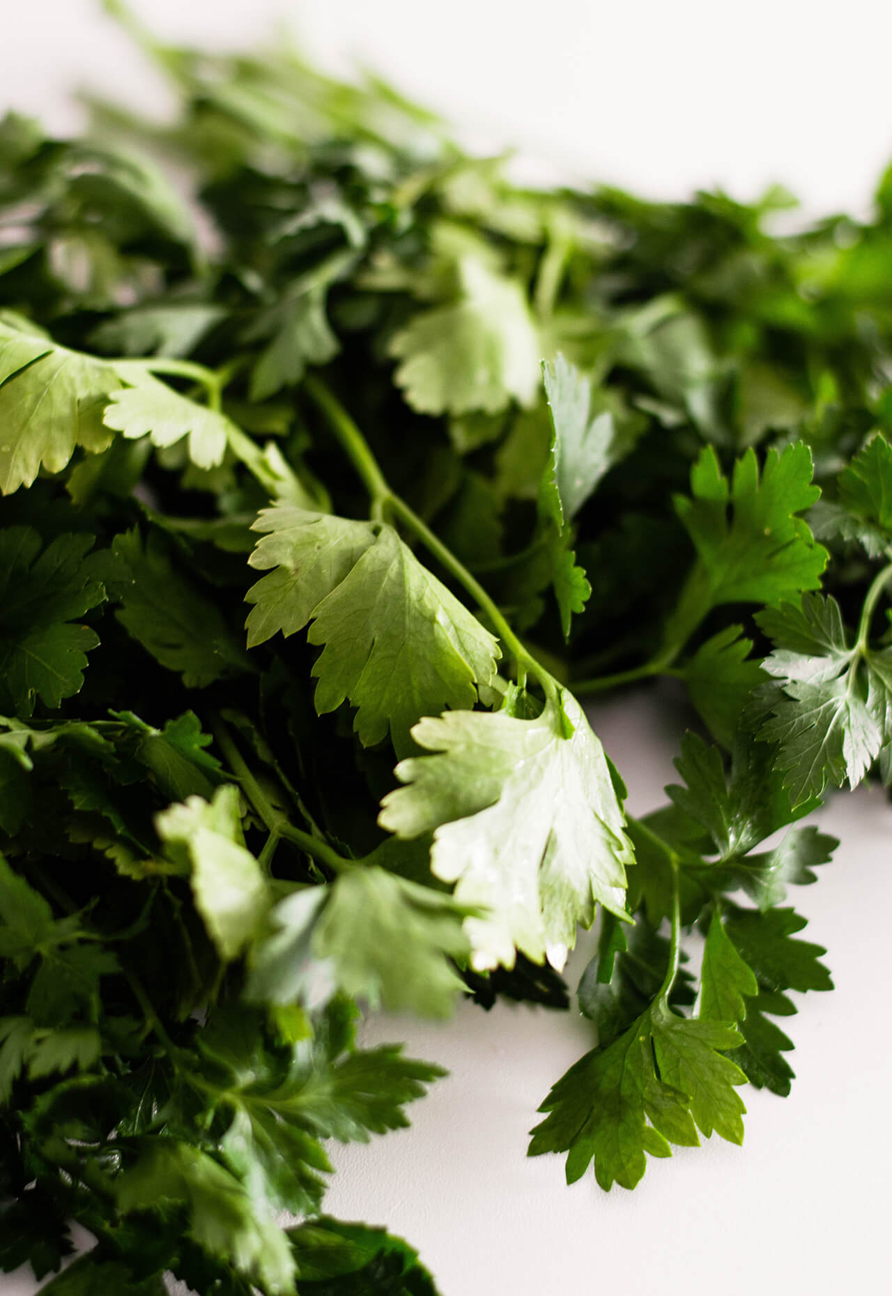 Recipe for simple parsley hummus, a fresh twist on a classic favorite, perfect dip for entertaining, spread for sandwiches or addition to dinner. 