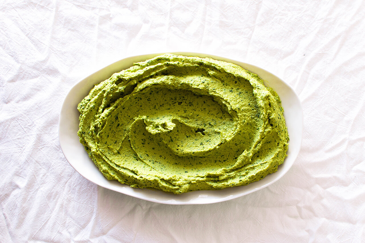 Recipe for simple parsley hummus, a fresh twist on a classic favorite, perfect dip for entertaining, spread for sandwiches or addition to dinner. 