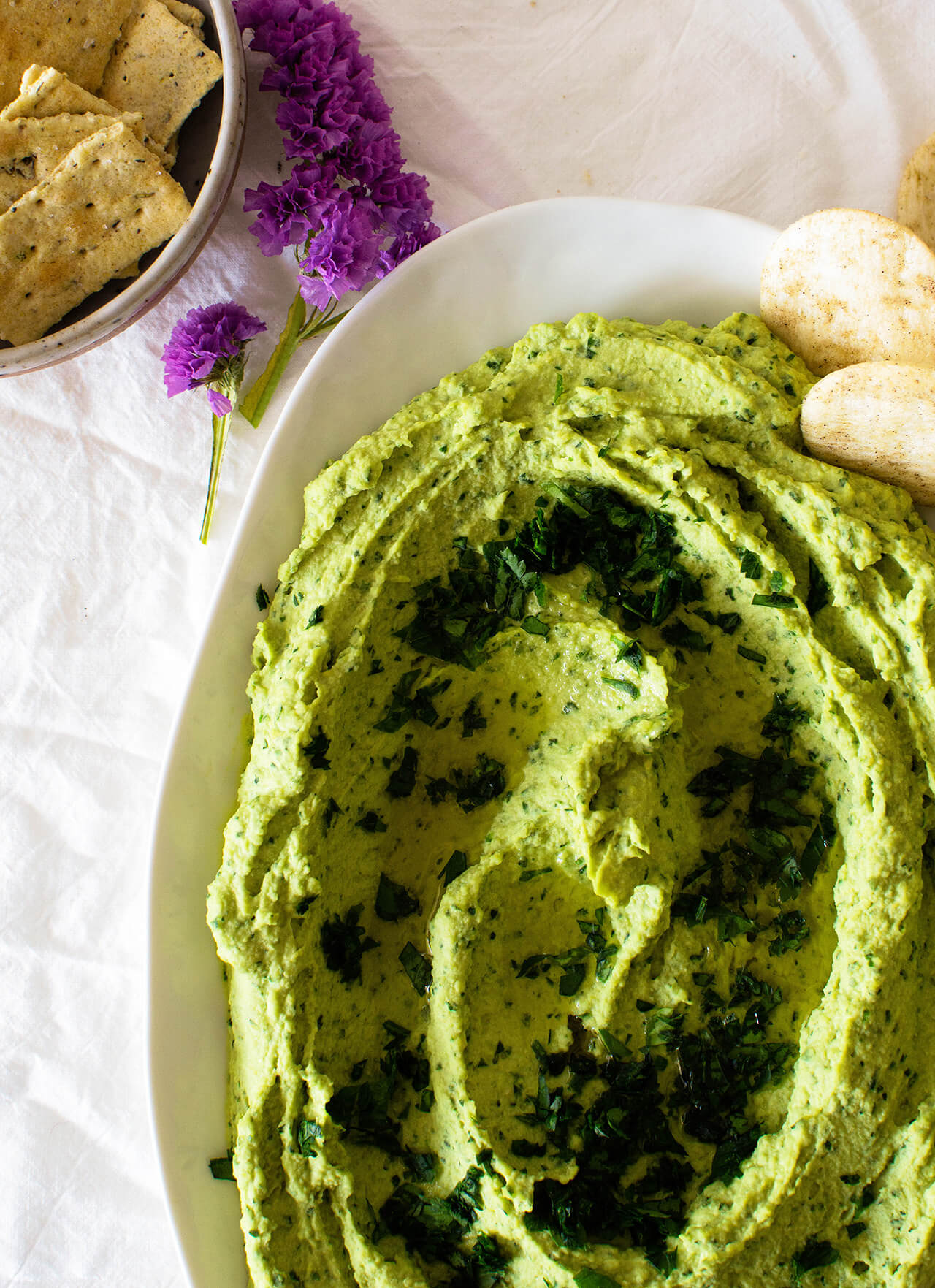 Recipe for simple parsley hummus, a fresh twist on a classic favorite, perfect dip for entertaining, spread for sandwiches or addition to dinner.