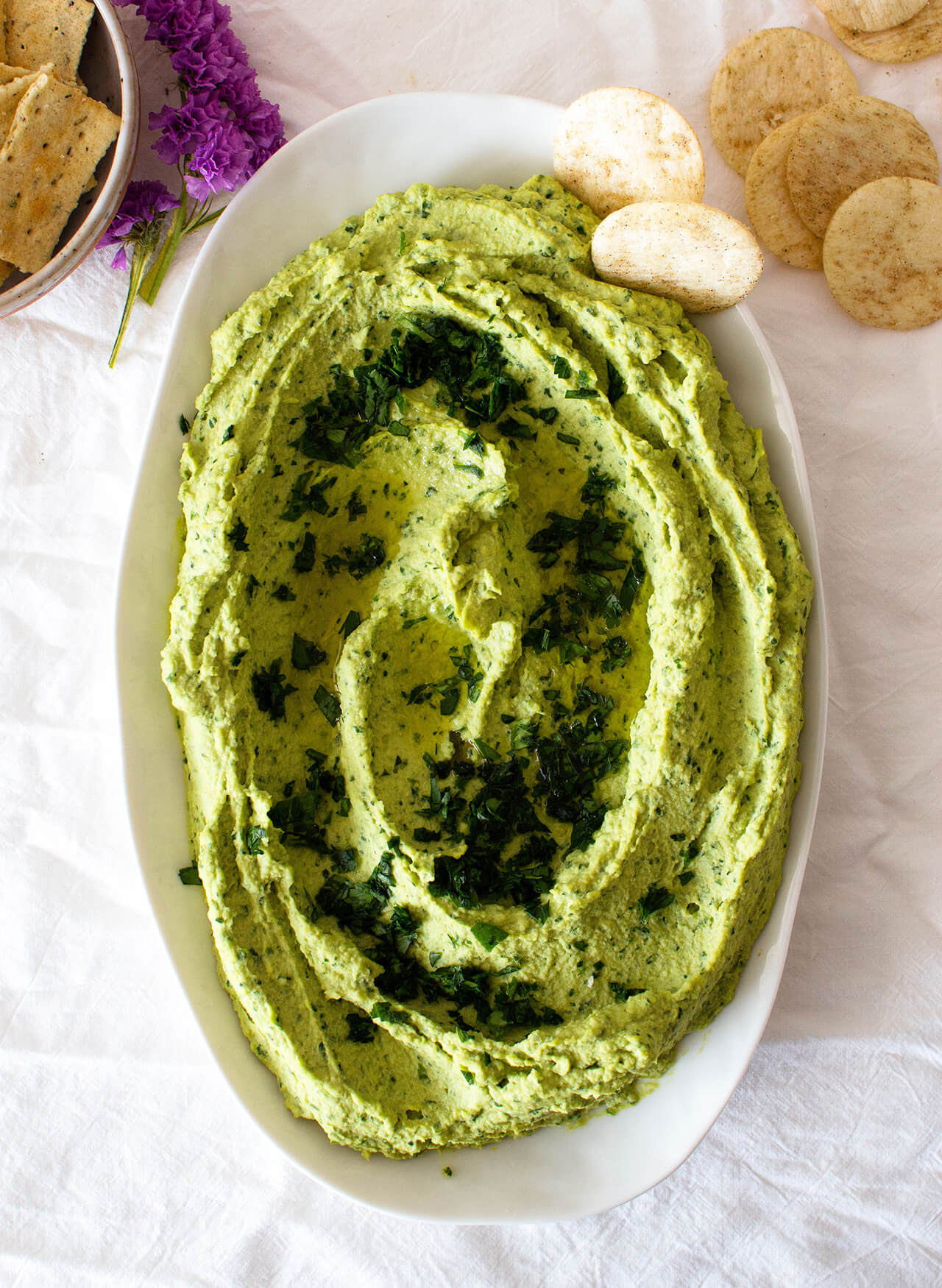 Recipe for simple parsley hummus, a fresh twist on a classic favorite, perfect dip for entertaining, spread for sandwiches or addition to dinner.