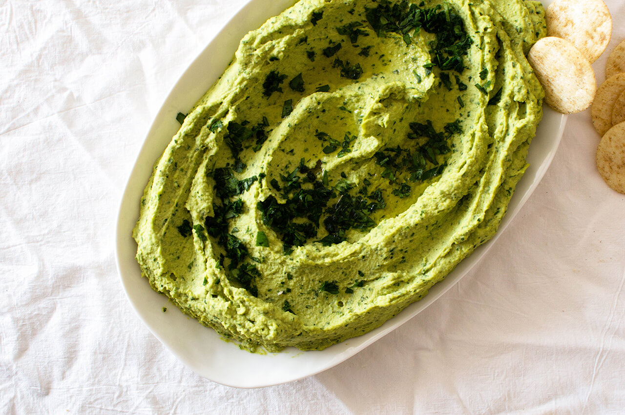 Recipe for simple parsley hummus, a fresh twist on a classic favorite, perfect dip for entertaining, spread for sandwiches or addition to dinner. 