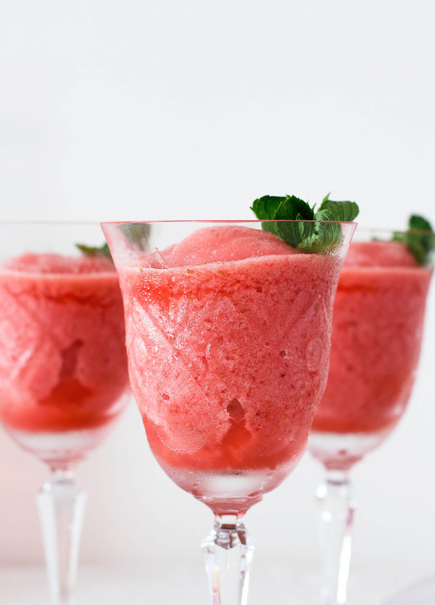 Super simple summer drink or dessert for adults. Lemon strawberry frosé (frozen rosé) that is refreshing, sweet and pretty to look at.