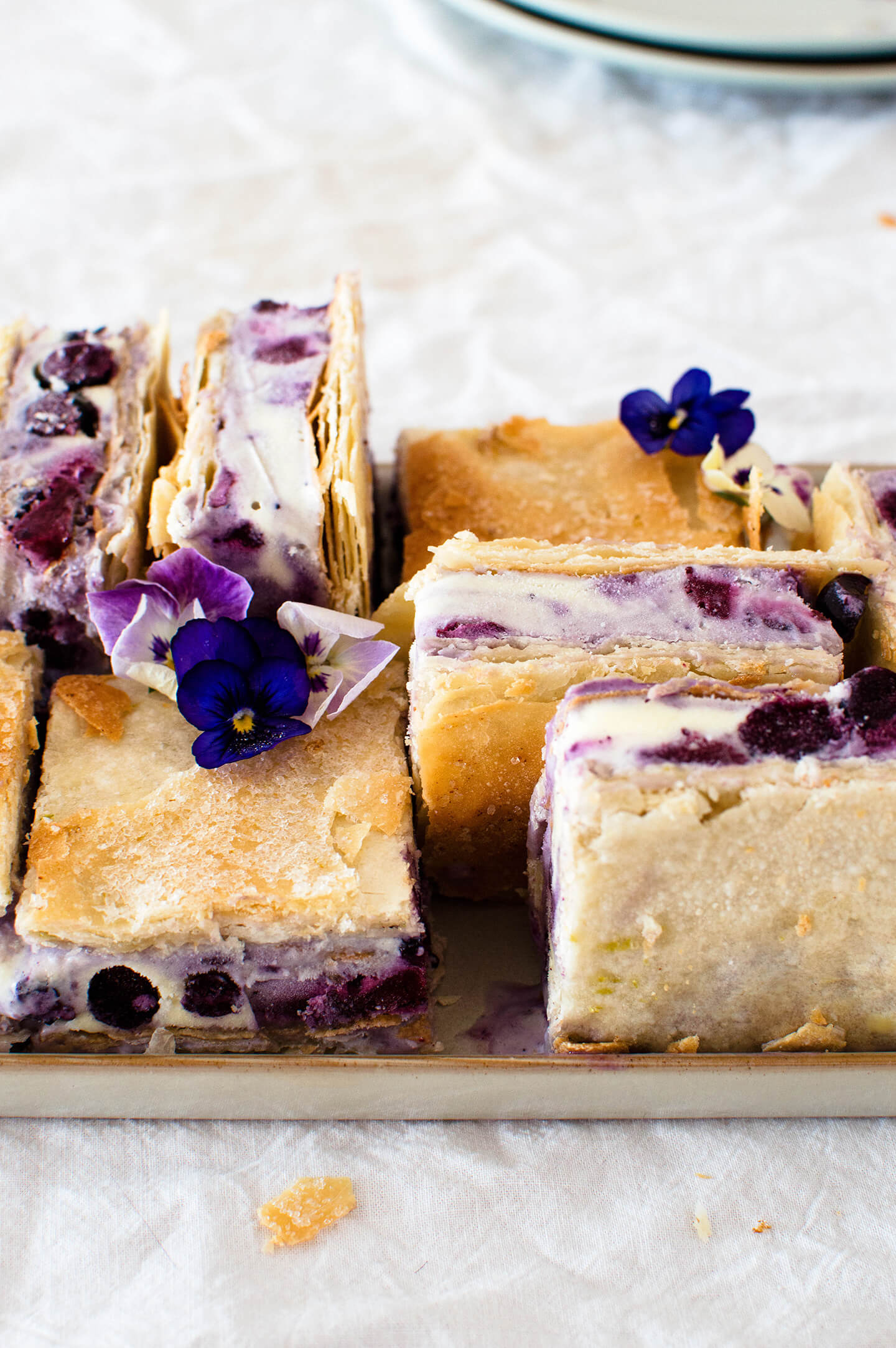 Roasted blueberry phyllo ice cream sandwiches are the perfect summer treat! Pretty to look at and tasty, filled with berries and lime sugar! 