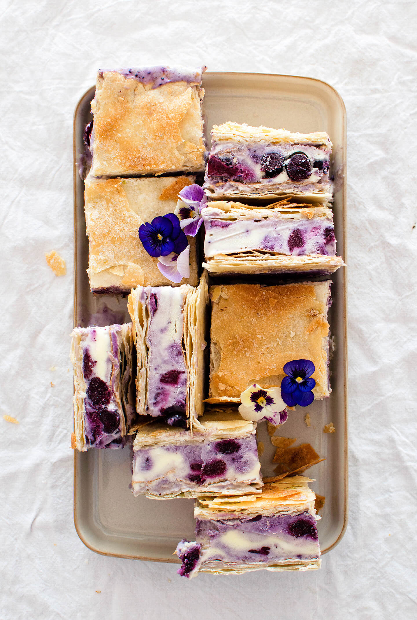 Roasted blueberry phyllo ice cream sandwiches are the perfect summer treat! Pretty to look at and tasty, filled with berries and lime sugar!