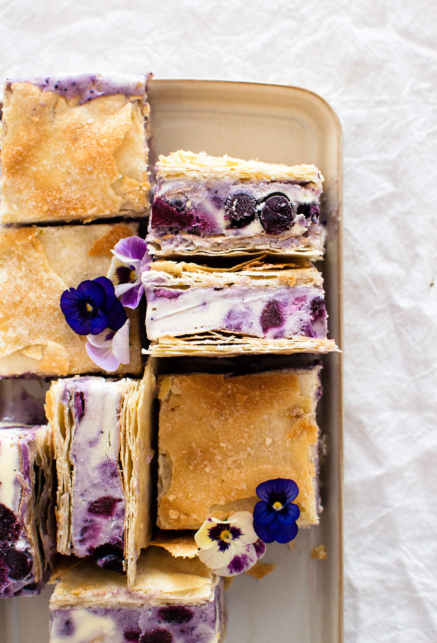 Roasted blueberry phyllo ice cream sandwiches are the perfect summer treat! Pretty to look at and tasty, filled with berries and lime sugar! 