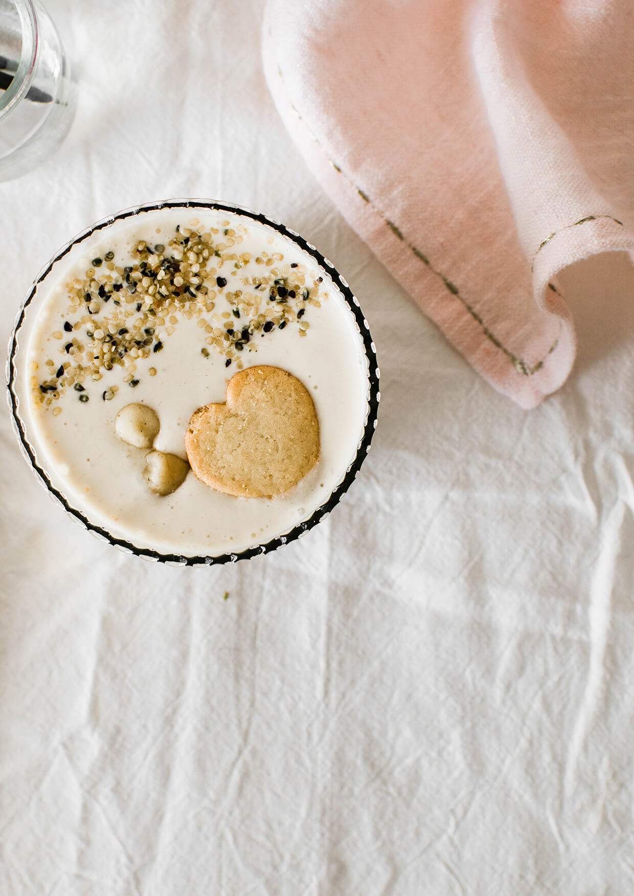 close view of beige colored banana smoothie in a glass