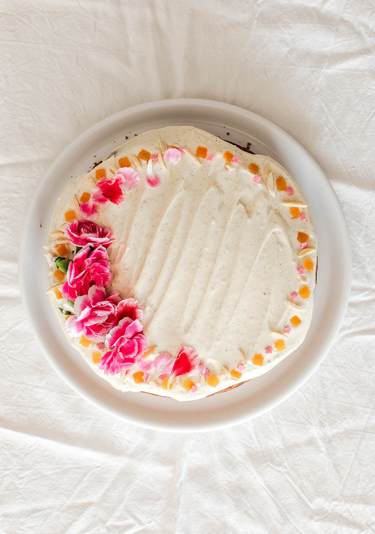 Orange almond carrot cake with creme fraiche frosting - cake on plate