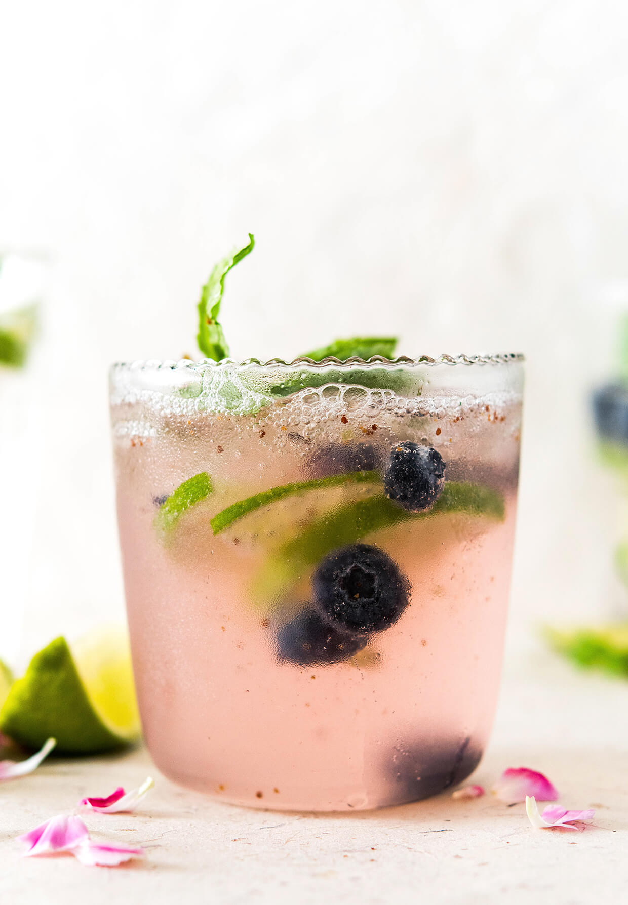 elderflower blueberry lime virgin cocktail - close up of drink in glass