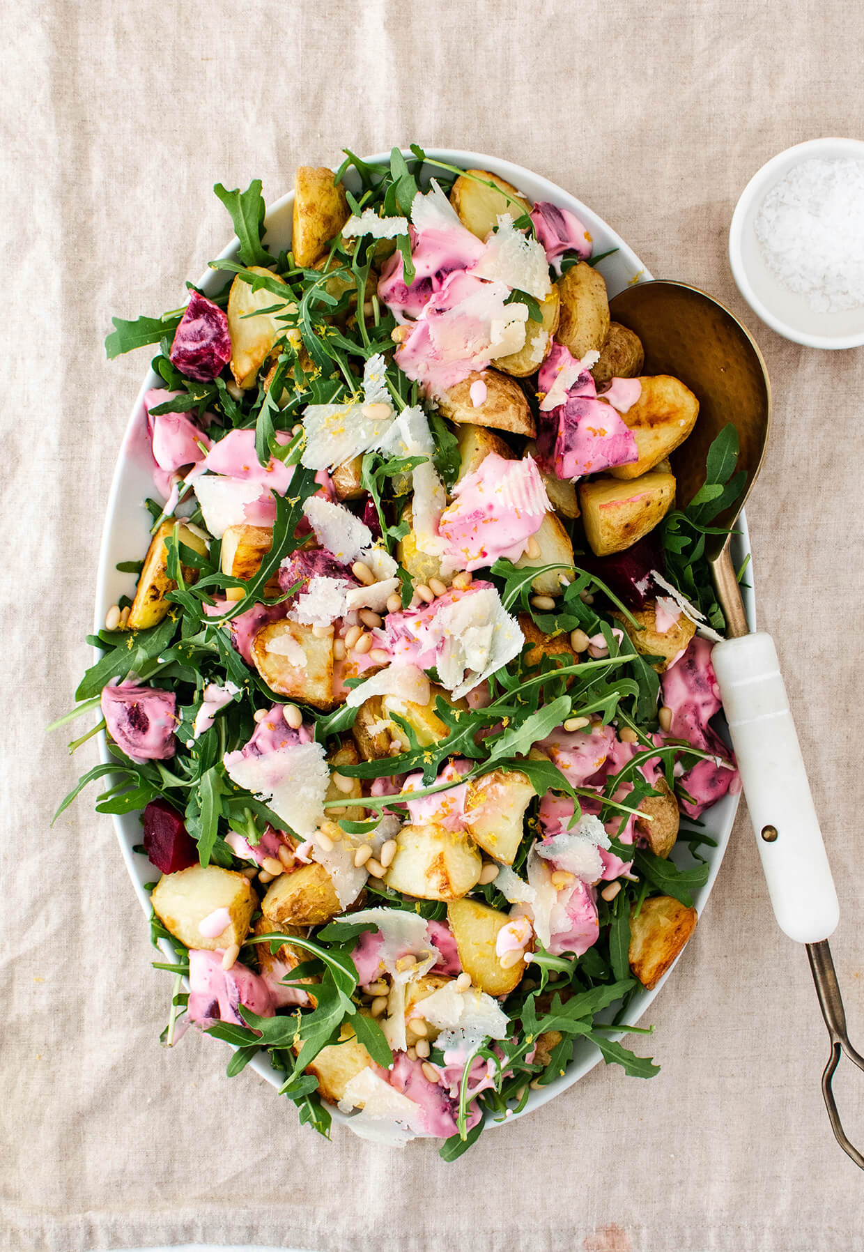 Roasted potatoes with arugula and creamy beets that will satisfy a crowd! A wholesome and simple vegetarian meal that comes together in 40 minutes!